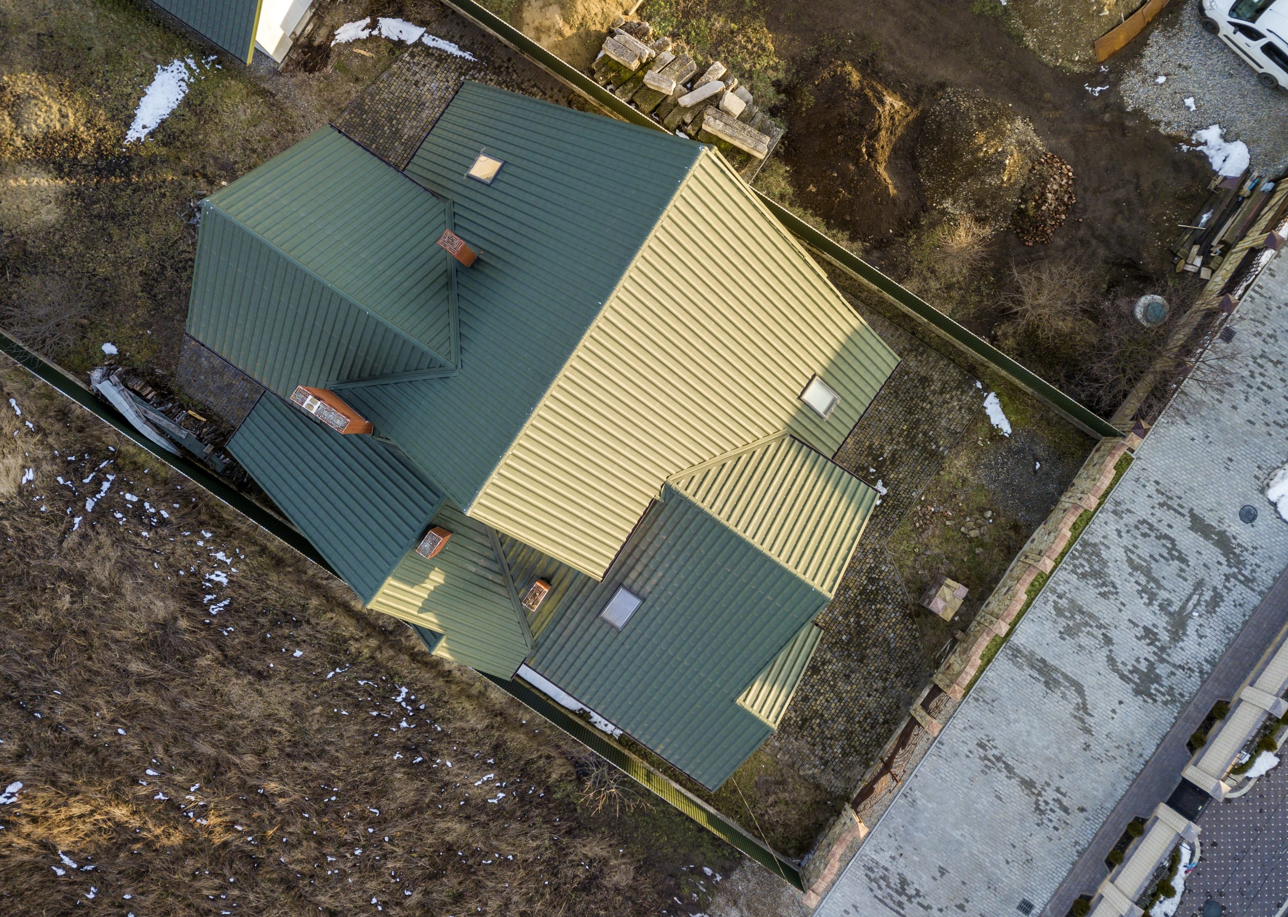 Metal residential roofing services in reference to the question "What is the cost of a metal roof?"