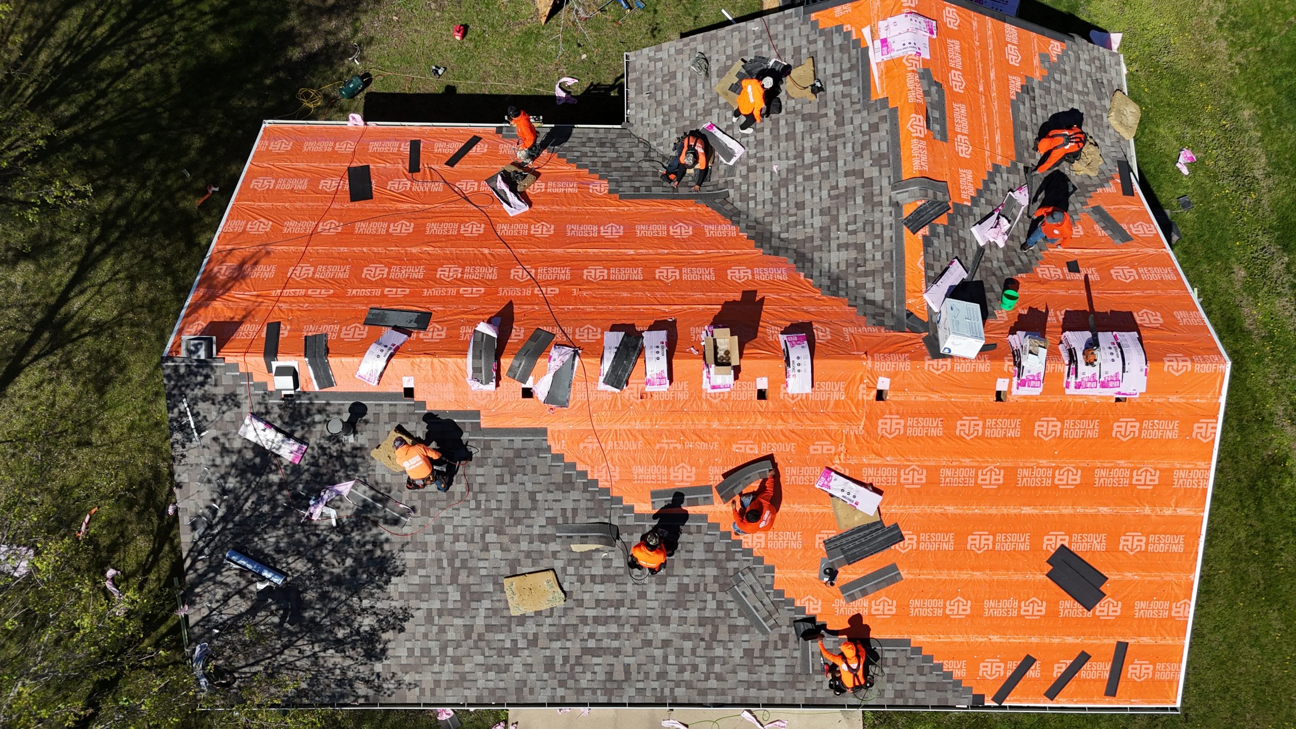 A roof replacement in progress, prompting the question "How long does a roof replacement take?"